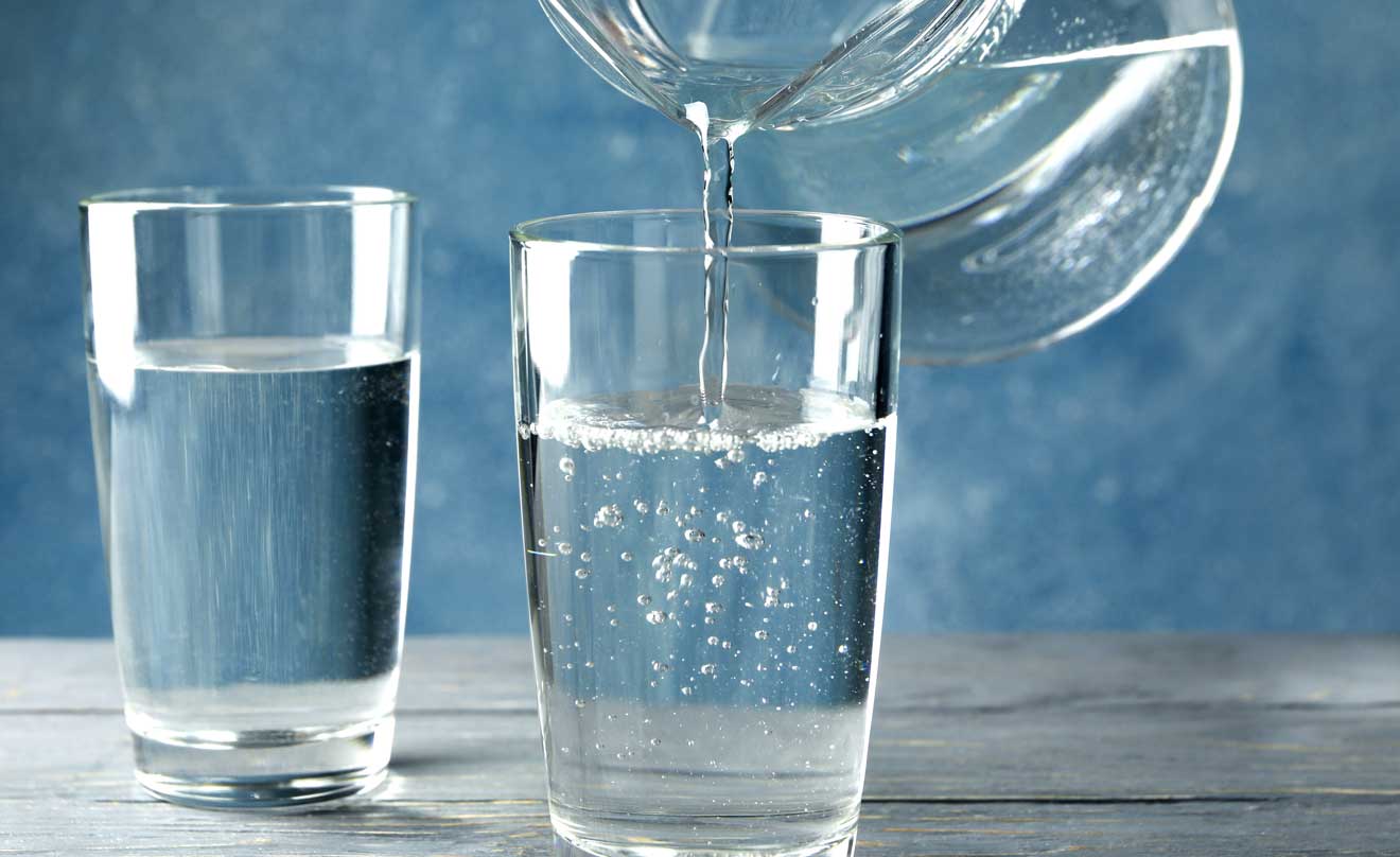 photo of water pouring into glass